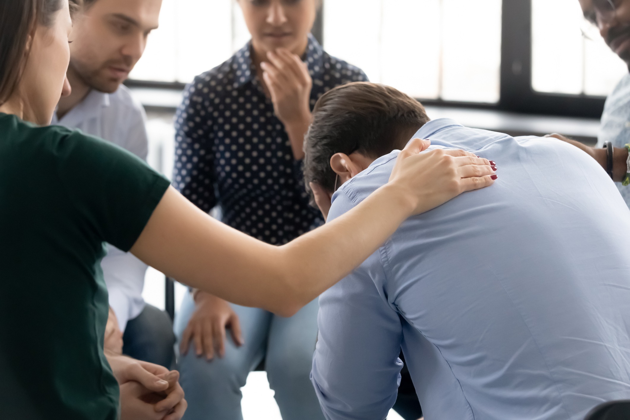 during-group-therapy-session-participants-supporting-crying-desperate-picture-id1254975614